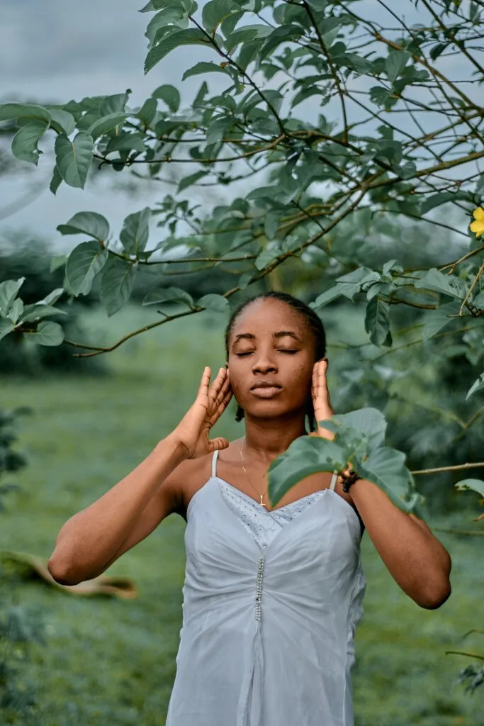 A woman in a relaxed outdoor wellbeing setting