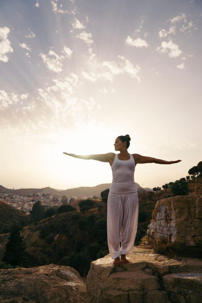 A woman practising gentle wellbeing movement